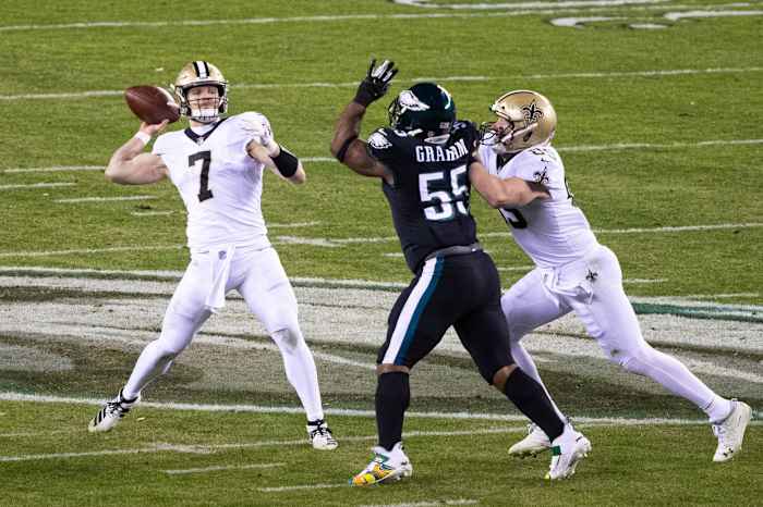 Dec 13, 2020; New Orleans Saints quarterback Taysom Hill (7) throws a pass pressured by Philadelphia Eagles defensive end Brandon Graham (55). Mandatory Credit: Bill Streicher-USA TODAY Sports